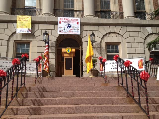 red ribbon city hall steps